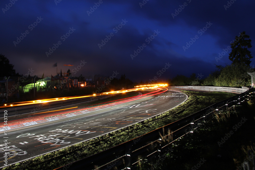 Racing car tail lights during the Nürburgring 24h race, long exposure at the Schwalbenschwanz bend 