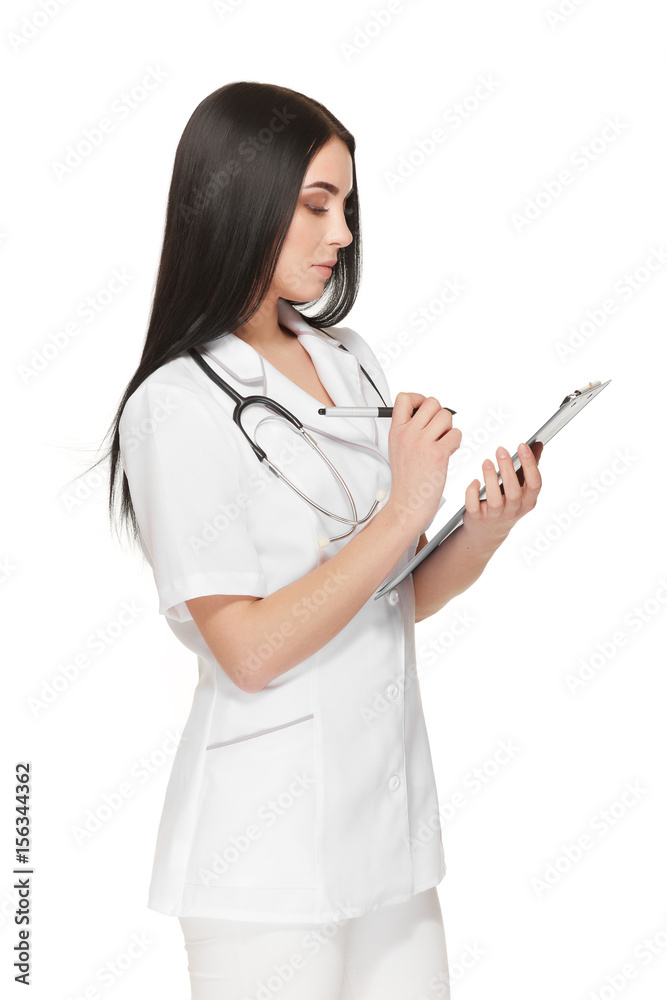 Serious female doctor with stethoscope around neck registering patient. Serious female doctor with stethoscope around neck registering patient.