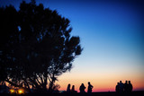 Silhouette of people standing at sunset, Heraklion, Greece