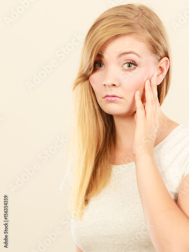 Sad cute young blonde attractive woman