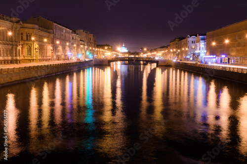 View of Lomonosov bridge across the Fontanka river  Saint-Petersburg  at night
