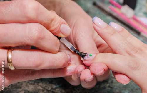 Girl makes manicure