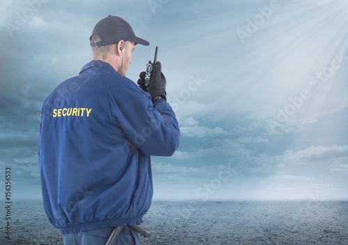 Security man outside with clouds