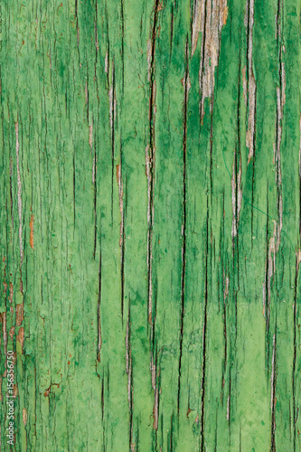 aged wooden plank with decayed green paint texture