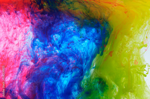 Fototapeta Naklejka Na Ścianę i Meble -  Abstract mixing colored paint in the water
