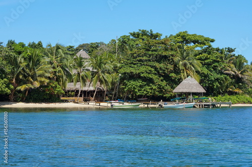 Coastline with an eco resort and lush tropical vegetation, Bocas del Toro, Caribbean sea, Panama, Central America