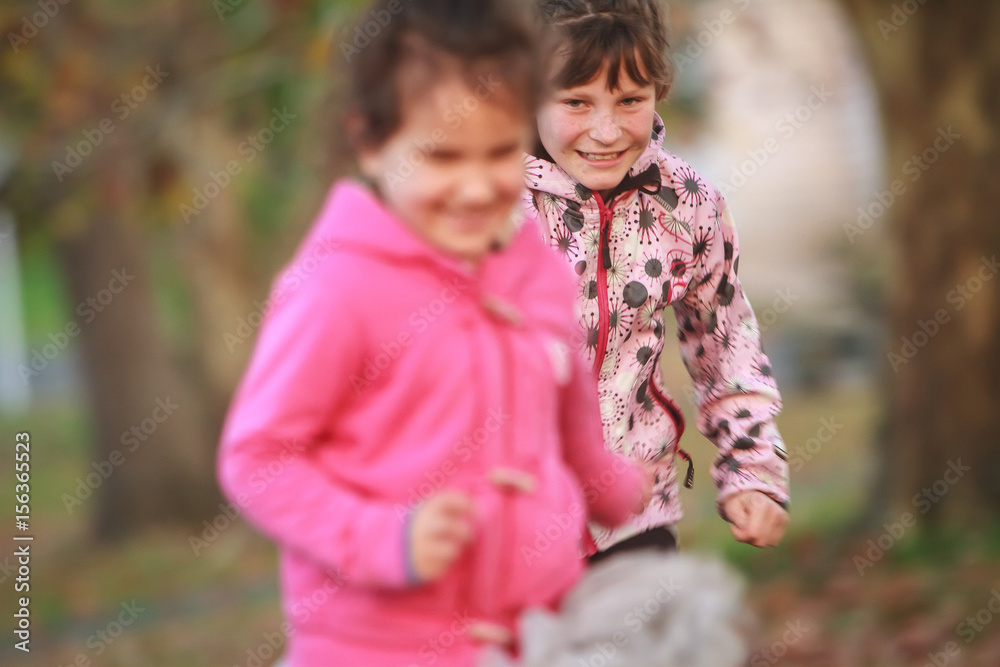 outdoor portrait of young happy child girl playing in park on natural background outdoor portrait of young happy child girl playing in park on natural background