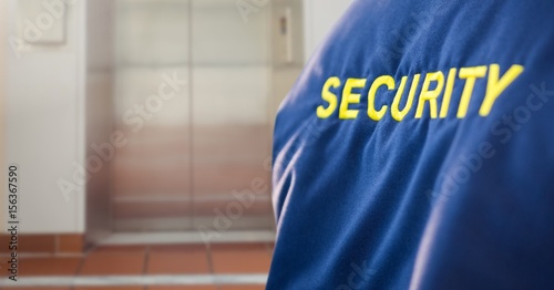 Security man outside lift door