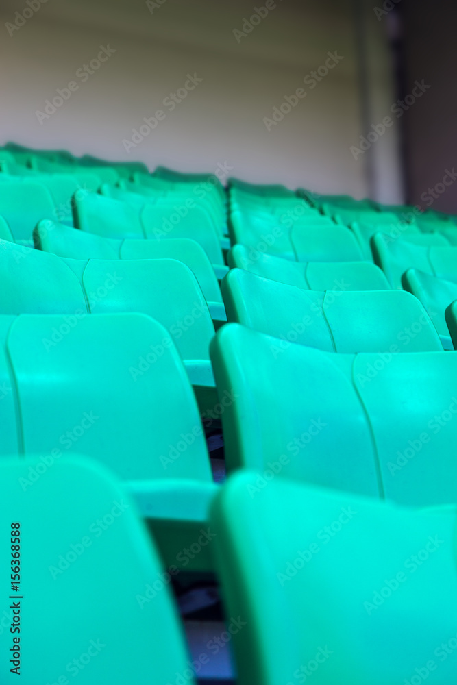 Fototapeta premium Green plastic seats at stadium