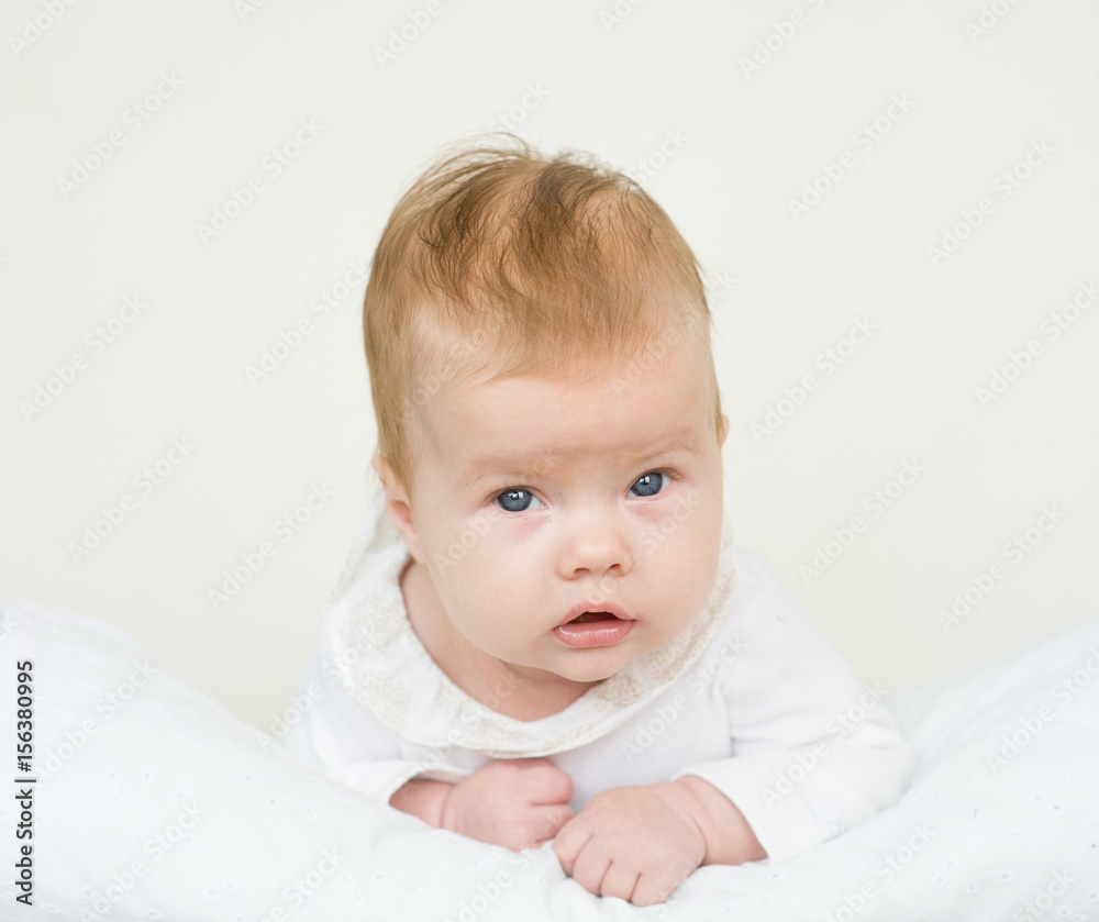 Newborn baby girl lying on her stomach