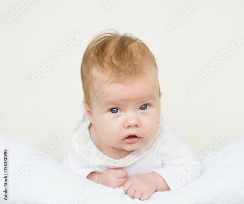 Newborn baby girl lying on her stomach