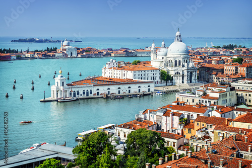 Beautiful view of the Grand Canal and Basilica Santa Maria della Salute in the late evening with very interesting clouds, Venice, Italy © beatrice prève