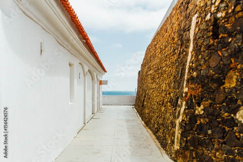 Corridor in Fort Sao Diogo with the sea background in Salvador, Brazil photo