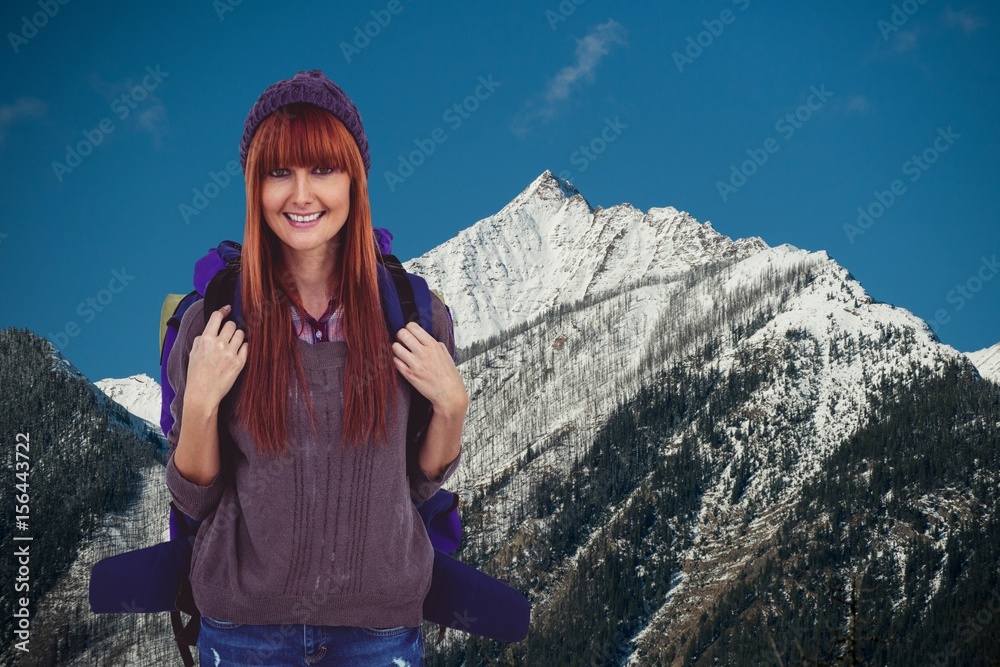 Red-hair woman smiling to the photo in montain