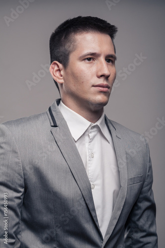 one young man, upper body, formal clothes, portrait sideways