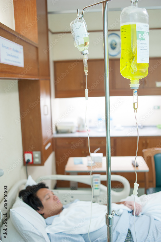 Brine for sick male patient lying in a hospita Brine for sick male patient lying in a hospita