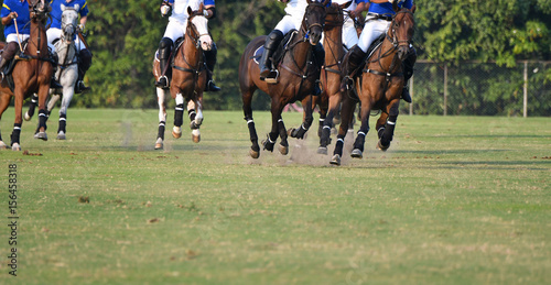 Polo players are riding