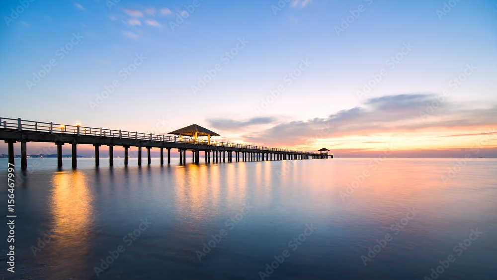 Summer, Travel, Vacation and Holiday concept - Wooden pier between sunset in Phuket, Thailand