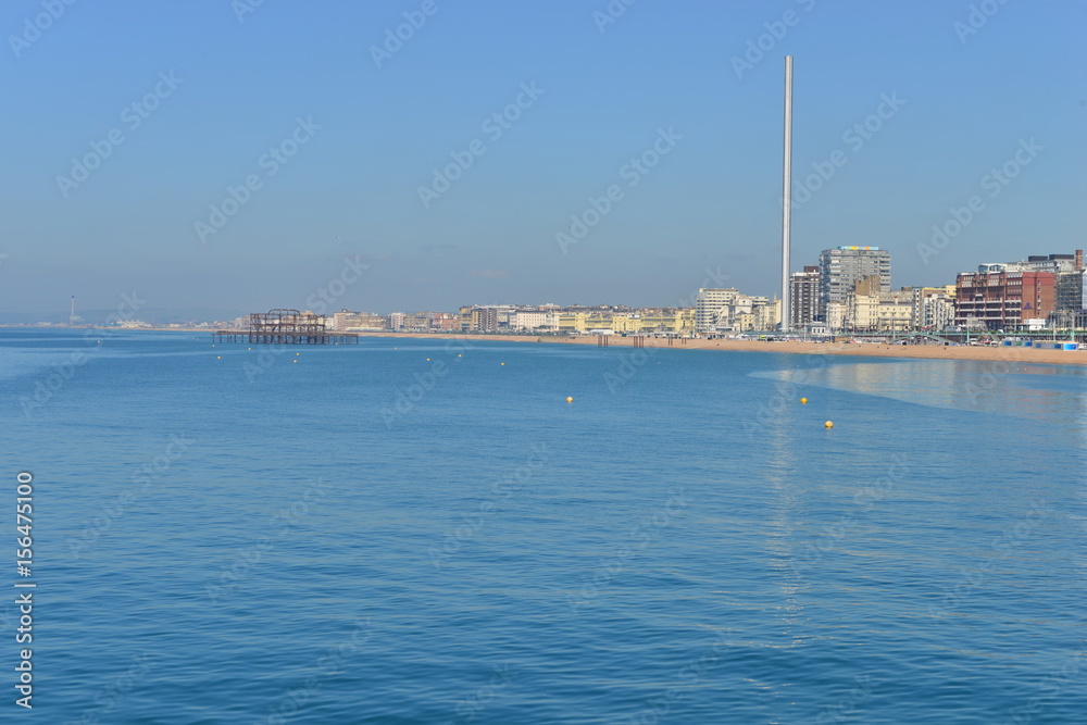The coast of Brighton on a hot day in May.
