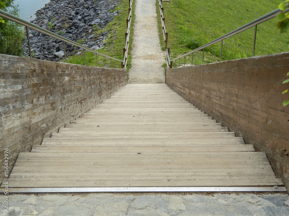 wooden stairs on lake dam