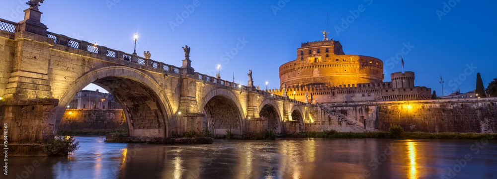Beautiful Angels bridge and castle in evening illumination, Rome, Italy