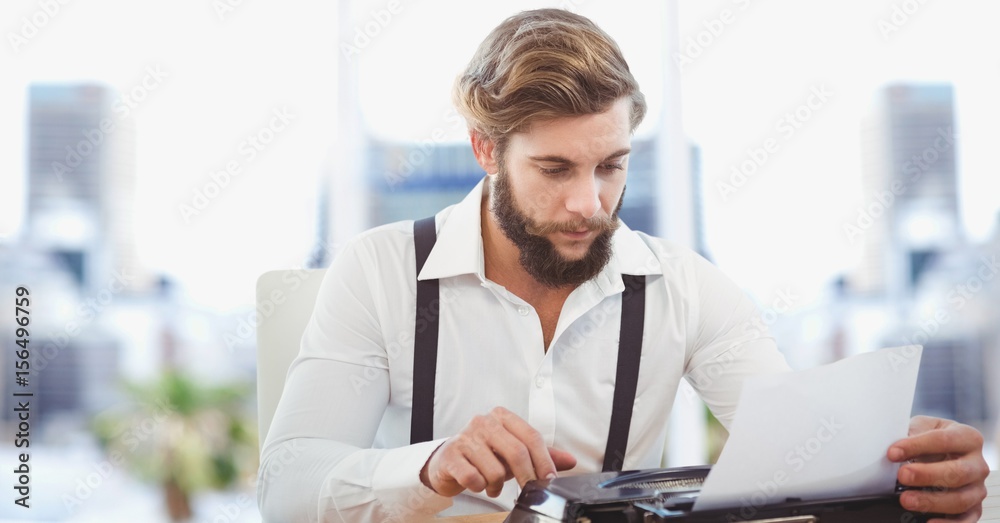 Fototapeta premium Creative businessman working on laptop in office