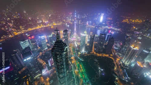 Wallpaper Mural Shanghai at night, time lapse. Aerial view of high-rise buildings with Huangpu River in Shanghai, China.  Torontodigital.ca