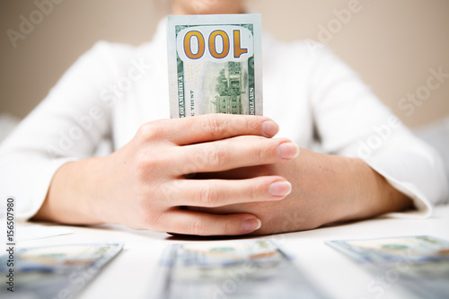 Woman hands holding money photo