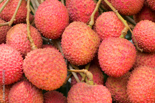 Fresh lychee fruit showing the red skin