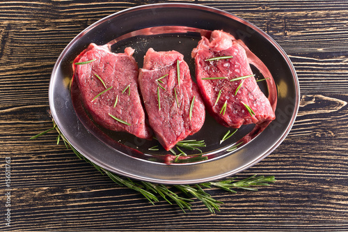 Beef steak with rosemary , salt and pepper.