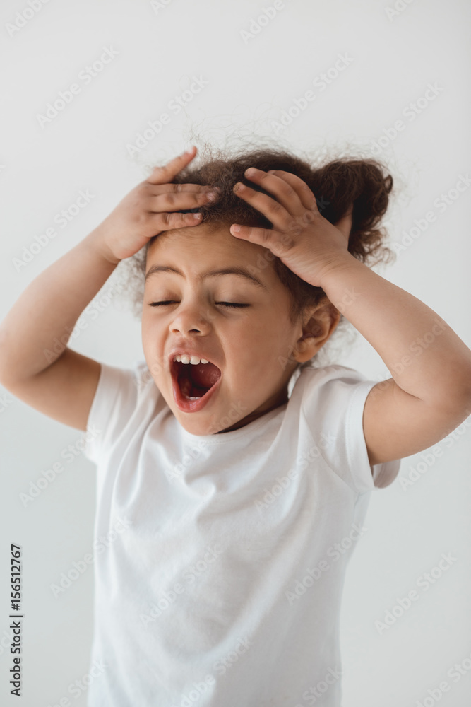 emotional little kid girl with facial expression isolated on white emotional little kid girl with facial expression isolated on white