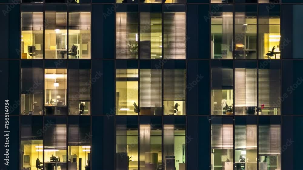 window of the multi-storey building of glass and steel lighting and people within timelapse window of the multi-storey building of glass and steel lighting and people within timelapse