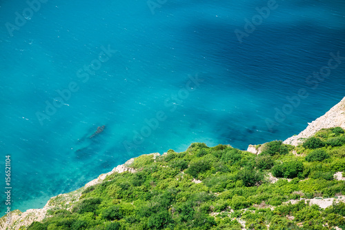 Blue sea and shore in Greece. Summer day on ocean