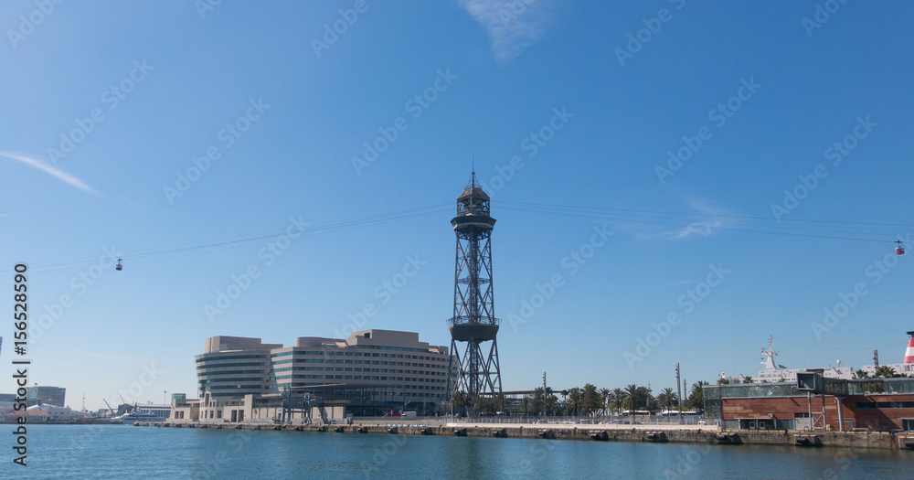 The port of Barcelona, at the end of the Ramblas. In the photo, the World trade center building and cable way tower in port of Barcelona, Catalonia, Spain