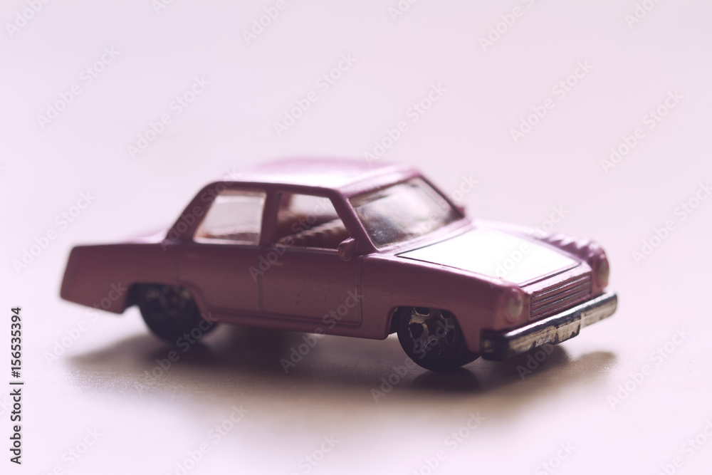 closeup of vintage toy pink car