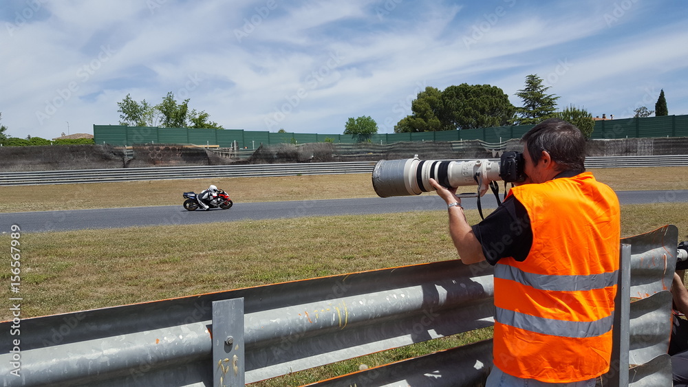 Photographer in a motor bike race