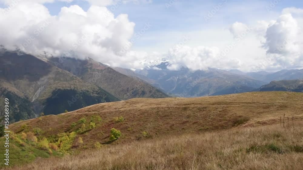 Panoramic view of Tetnuldi prominent peak in the central part of the Greater Caucasus Mountain Range, located in the Svaneti region of Georgia. HD video (High Definition). Timelapse Panoramic view of Tetnuldi prominent peak in the central part of the Greater Caucasus Mountain Range, located in the Svaneti region of Georgia. HD video (High Definition). Timelapse