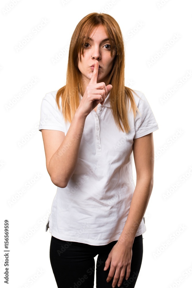 Beautiful young girl making silence gesture Beautiful young girl making silence gesture