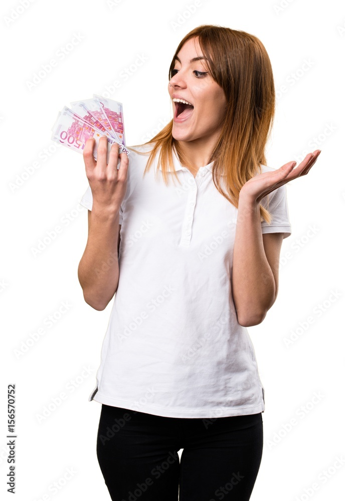 Happy Beautiful young girl taking a lot of money