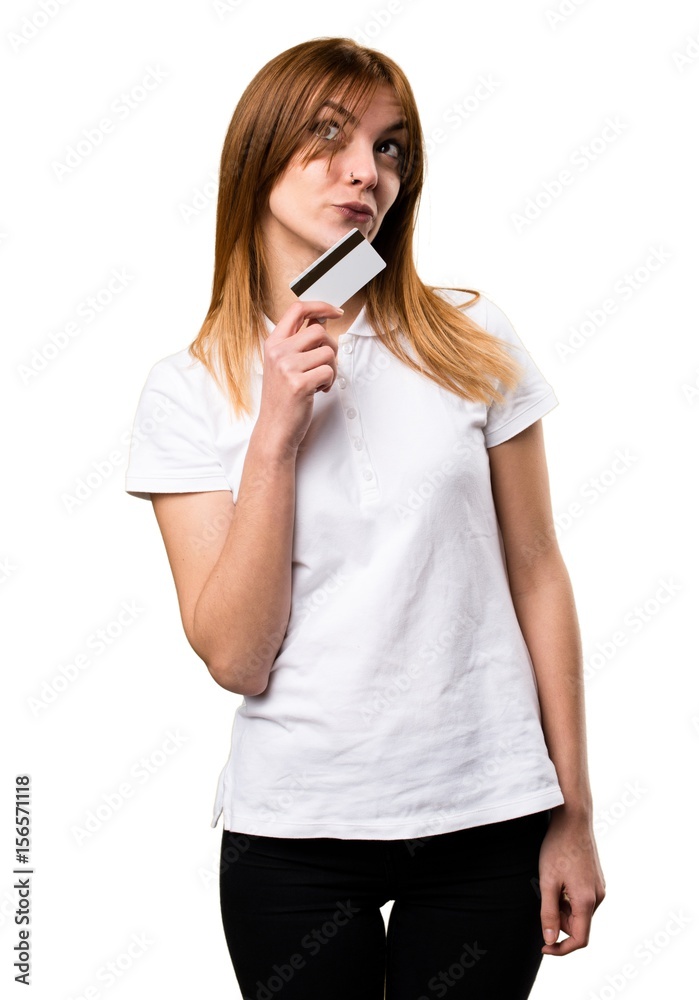 Beautiful young girl holding a credit card Beautiful young girl holding a credit card