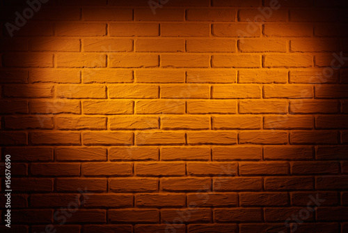 brown brick wall with heart shape light effect and shadow  abstract background photo