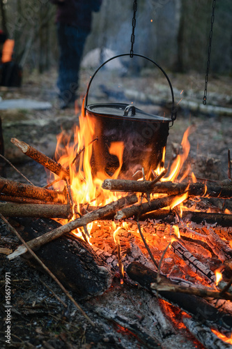 Evening campfire with kettle