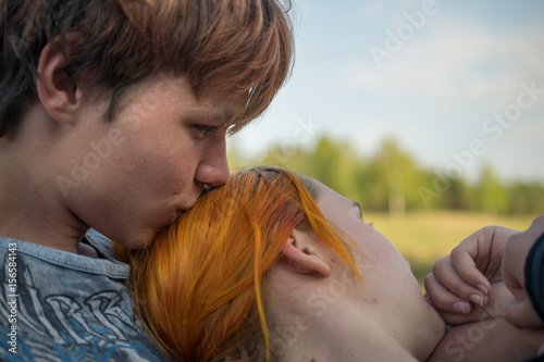Hanging romantic red haired couple