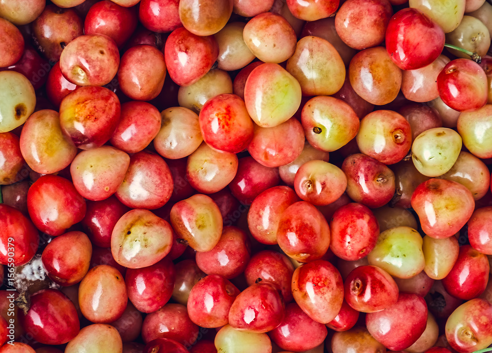 Fresh yellow cherries background, top view Fresh yellow cherries background, top view