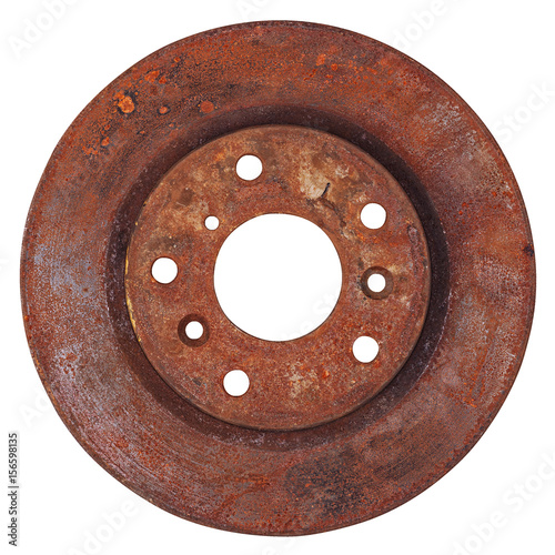 Old rusty brake disc from car isolated on white background
