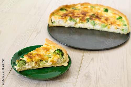 Wallpaper Mural Traditional French quiche Lorraine with chicken, egg, milk, cheese broccoli and corn on a wooden background. Torontodigital.ca