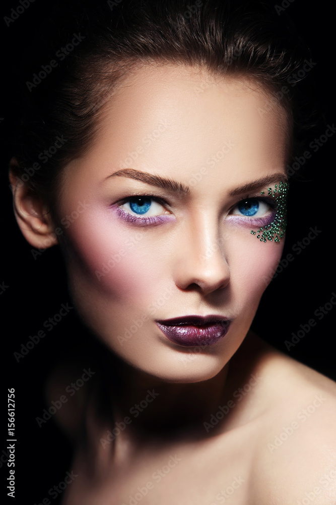 Portrait of young beautiful woman with stylish glitter make-up, selective focus Portrait of young beautiful woman with stylish glitter make-up, selective focus