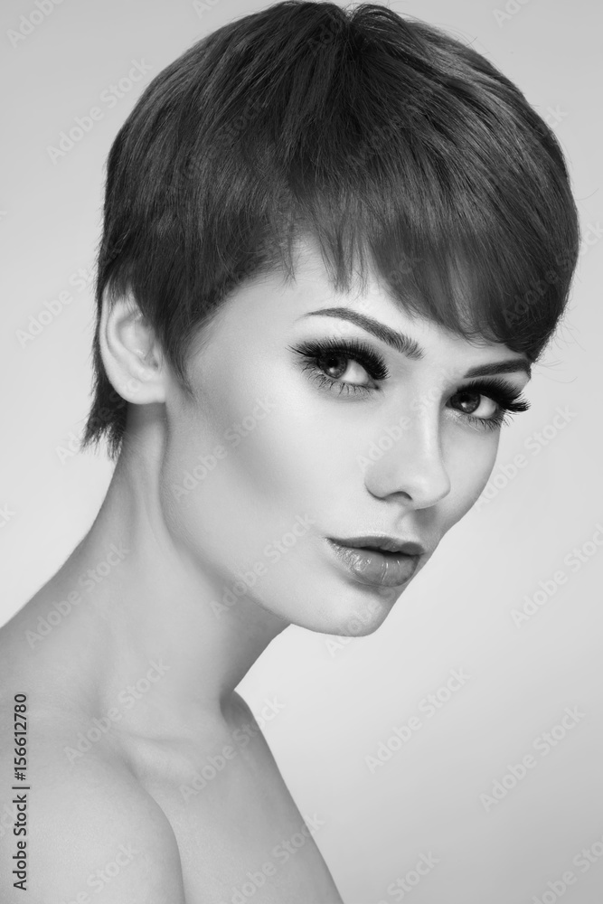 Black and white portrait of young beautiful woman with stylish short haircut Black and white portrait of young beautiful woman with stylish short haircut