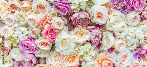 Flowers wall background with amazing red and white roses  Wedding decoration  hand made. Toning.