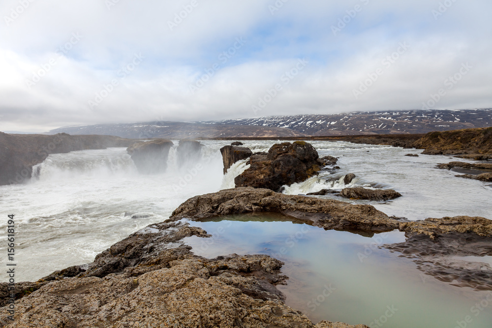 The Godafoss Waterfall - beautiful part of stony rocky desert landscape of Iceland The Godafoss Waterfall - beautiful part of stony rocky desert landscape of Iceland